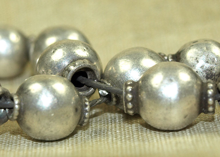 Strand of small Antique Silver Beads from India