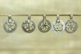 Set of five small silver floral pendants from India