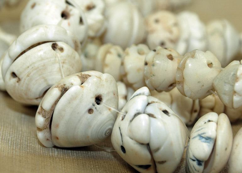 Strand of Carved Shell Bead Caps from Mali