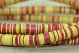 Creamy Yellow, Red, and Black Plastic Disc Beads