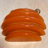Carved Orange Bakelite Pendant