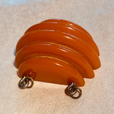 Carved Orange Bakelite Pendant