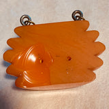 Carved Orange Bakelite Pendant