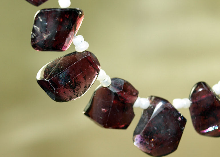 Strand of One-Sided Faceted Garnet Beads