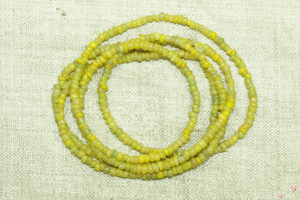 Tiny ancient Greenish-Yellow Tradewind Beads