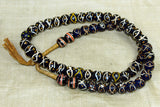 Black Swirls with Gold Eyes Venetian Trade Beads