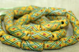 Yellow Venetian beads with stripes and dots