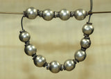 Strand of 12 Antique Silver Beads from India