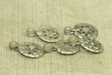 Set of five small silver floral pendants from India