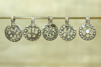 Set of five small silver floral pendants from India