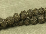 Strand of Yoruba Brass Fabricated Beads with Pendant