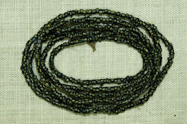 Small Black Seed beads with white and green stripes