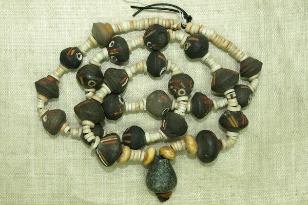 Large handcrafted black clay beads with red