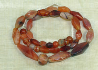 Strand of Assorted Hand-Carved Carnelian Beads from the Lou Zeldis Collection