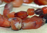 Strand of Assorted Hand-Carved Carnelian Beads from the Lou Zeldis Collection