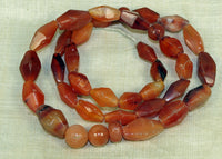 Strand of Hand-Carved Carnelian Bicones from the Lou Zeldis Collection