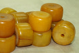Pale yellow amber cylindrical bead