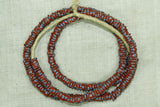 Strand of Brick Red and Blue Eja/Aja Beads