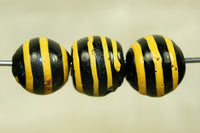 Black Glass Bead with Yellow stripe