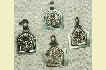 Three Vintage Goddess Hoi Mata Silver Amulets