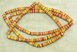 Creamy Yellow, Red, and Black Plastic Disc Beads