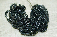 Small Hanks of Vintage 3-Cut Hematite Glass Beads