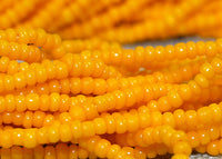 Hank of 16º Bright Yellow-Orange Seed Beads