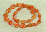 Vintage German Glass Beads - Twisted Oval Orange